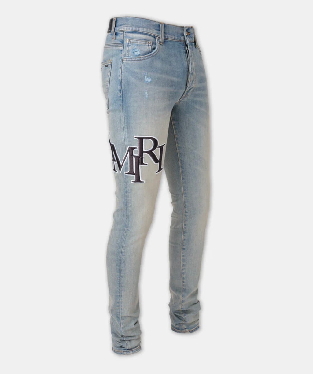 STAGGERED EMBROIDERED LOGO AMIRI JEAN